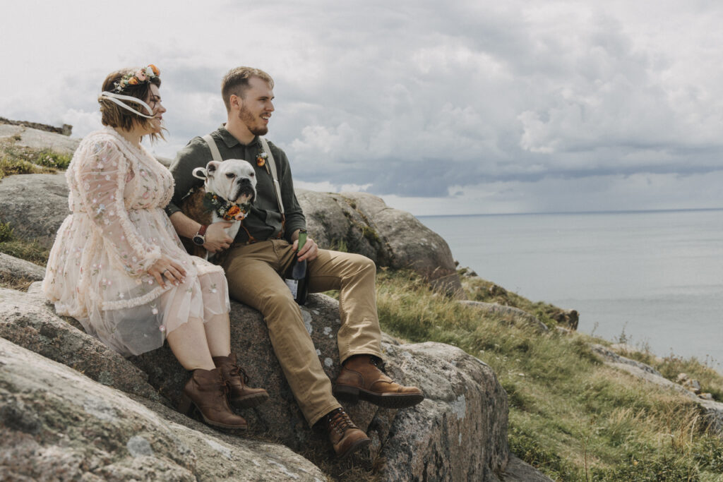 Boho wedding couple on the cliff of Bornholm Danish island for weddings