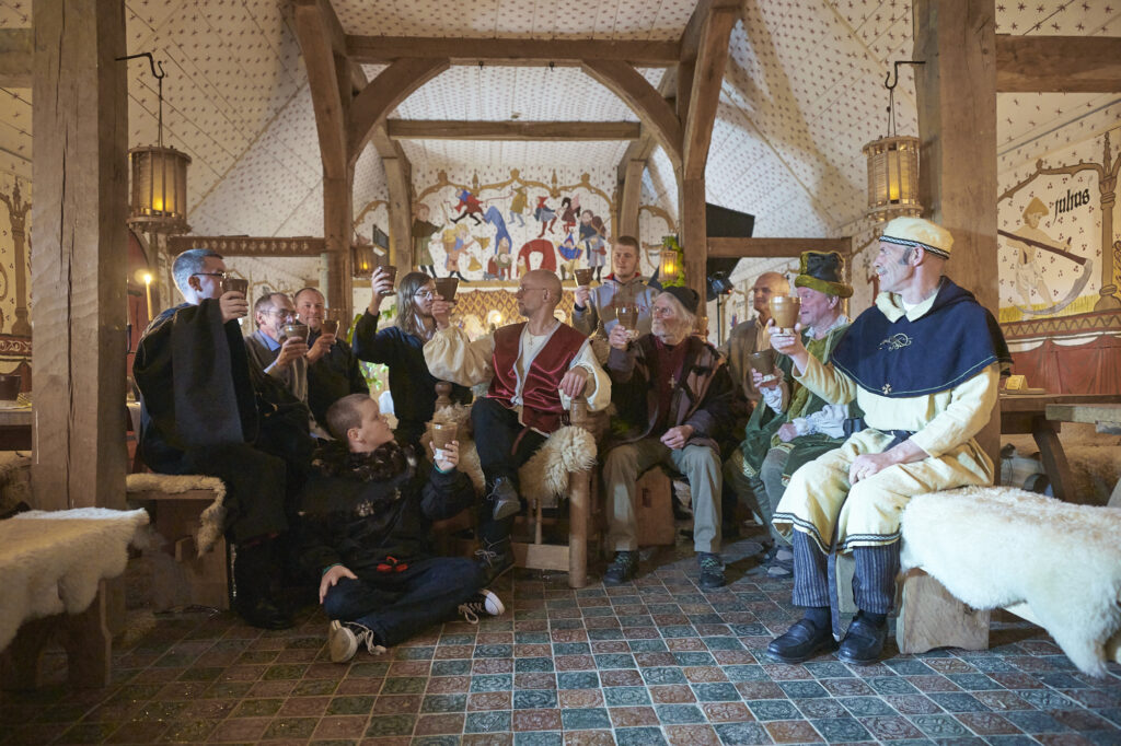 A group of wedding guests in Medieval center in Bornholm